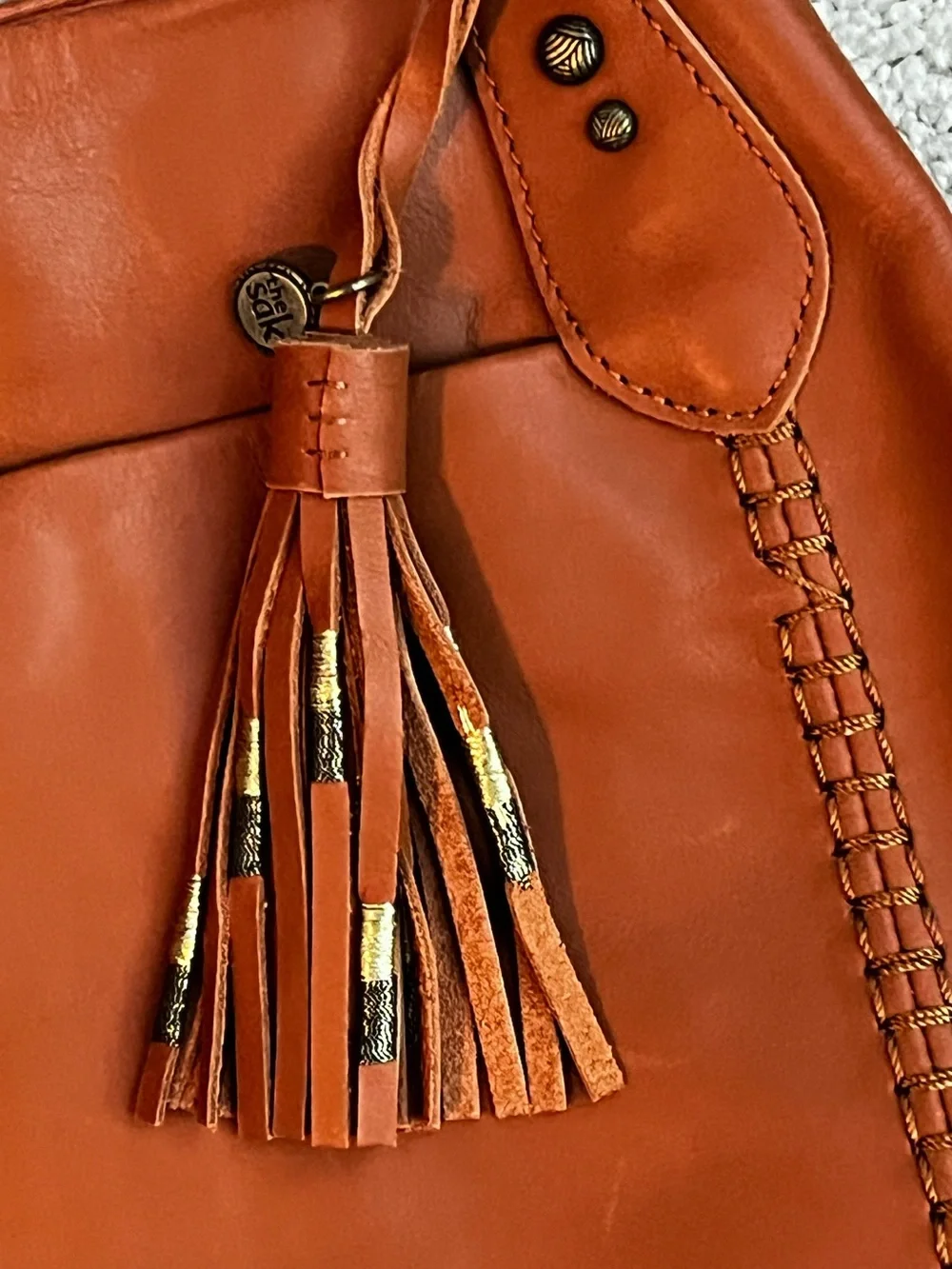 The Sak Melrose Shoulder Bag Purse Brown Leather Tassel Charm Many Pockets